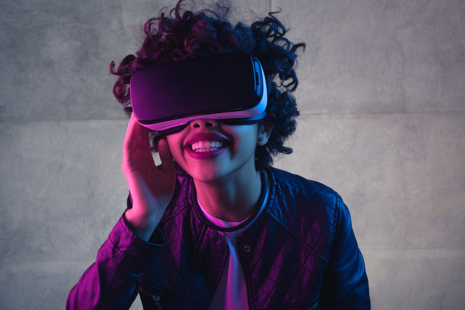 Smiling black woman having virtual reality experience